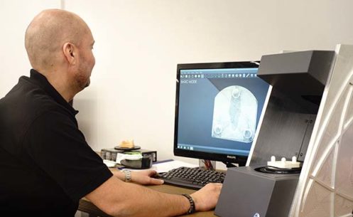Man working with DentalCad software and Dscan 3D scanner